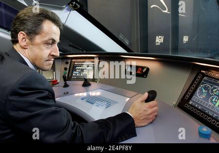 President Nicolas Sarkozy sits at the controls in the driver's compartment of the new high-speed train, AGV, at the plant of the French engineering company Alstom, in La Rochelle, western France, on February 5, 2008. Alstom, in cooperation with French National Railways SNCF, has developed a new design of TGV called AGV. It will be the first articulated high-speed train with distributed traction rather than power cars at each end. Photo by Christophe Ena/Pool/ABACAPRESS.COM Stock Photo