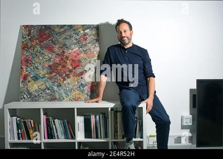 England / London /Forensic Architecture/ Eyal Weizman, the founder of Forensic Architecture sitting next to a satellite image from Rafah. Stock Photo