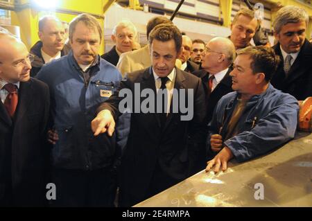 'Jean-Marie Poimboeuf and French President Nicolas Sarkozy talk with workers of French shipbuilder DCNS where the nuclear submarine 'le Terrible' was built in Cherbourg, western France March 21, 2008. President Sarkozy visited France's new generation nuclear-armed submarine''Le Terrible''. Photo by Jacques Witt/Pool/ABACAPRESS.COM' Stock Photo
