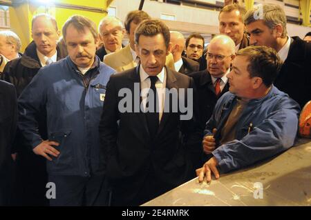'Jean-Marie Poimboeuf and French President Nicolas Sarkozy talk with workers of French shipbuilder DCNS where the nuclear submarine 'le Terrible' was built in Cherbourg, western France March 21, 2008. President Sarkozy visited France's new generation nuclear-armed submarine''Le Terrible''. Photo by Jacques Witt/Pool/ABACAPRESS.COM' Stock Photo