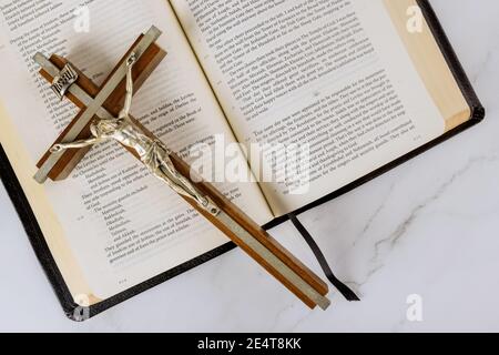 22 JANUARY 21 New York US 2021: Cross over a Holy Bible with salvation Jesus on way to God through prayer Stock Photo
