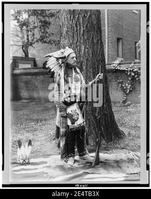 Matthew Stanley Quay, full-length portrait, standing, facing right, dressed in Indian costume, holding rifle Stock Photo