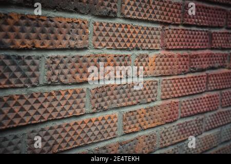 Old brick wall close up. Rhombus patterned brick. Stock Photo