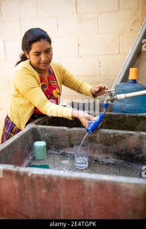 Home tap-based water filter system in use in San Juan la Laguna, Guatemala. Stock Photo