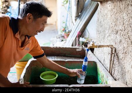 Home tap-based water filter system in use in San Juan la Laguna, Guatemala. Stock Photo