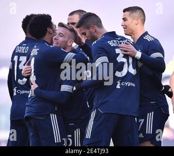 Turin, Italy. 24th Jan, 2021. FC Juventus' Arthur (C) celebrates his goal with teammates during a Serie A football match between FC Juventus and Bologna in Turin, Italy, Jan. 24, 2021. Credit: Federico Tardito/Xinhua/Alamy Live News Stock Photo