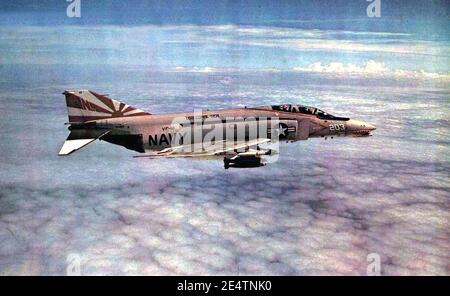 McDonnell F-4B Phantom II of VF-161 drops M117 bomb over Vietnam, circa ...