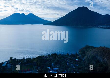 Beautiful scenery on Lake Atitlán showing Volcán San Pedro and Volcán de Atitlán, Guatemala, Central America. Stock Photo