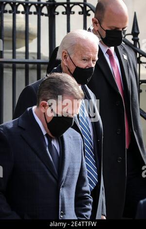 United States President Joe Biden, center, and his son Hunter, left, leaves the Holy Trinity Catholic Church in the Georgetown neighborhood of Washington, DC on January 24, 2021. Credit: Oliver Contreras/Pool via CNP/MediaPunch Stock Photo