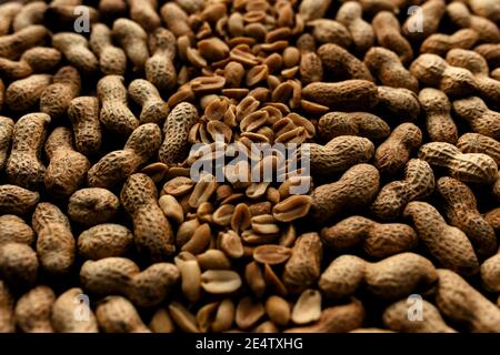 Heap of raw peanuts on the table Stock Photo