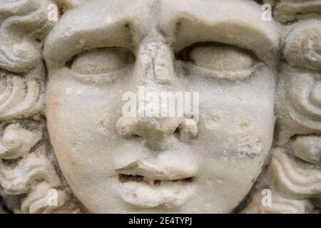 Face Relief on the tomb in ancient city of Ephesus, Turkey. Stock Photo