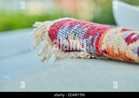 Small carved rug on white background Stock Photo