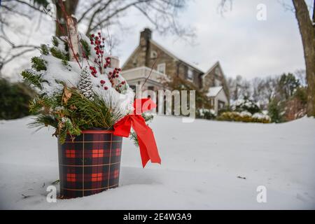 Holiday decorations in snow - snowy outdoor Christmas decorations Stock Photo