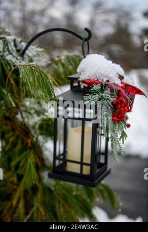 Holiday decorations in snow - snowy outdoor Christmas decorations Stock Photo