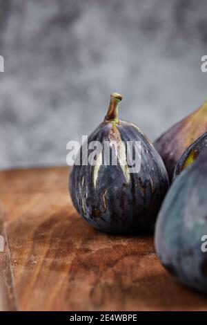 Fresh ripe figs on a wooden board Stock Photo
