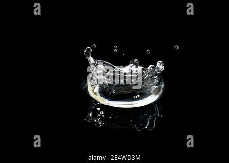 water splash isolated on black. fresh clean transparent drinking water splash. Stock Photo