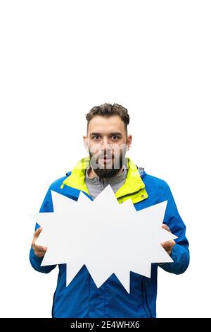 amazed young bearded man holding empty blank board on white background. Stock Photo