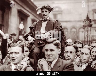Eric Liddell (1902-1945) being carried around Edinburgh University on July 18, 1924, after winning the Gold Medal for the 400 metre race in the 1924 Paris Summer Olympics. The following year, Liddell, a devout Christian, went to China as a missionary. Aside from two furloughs in Scotland, he remained in China until his death in a Japanese civilian internment camp in 1945. Stock Photo