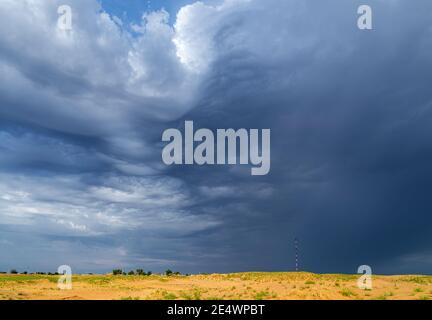 Dramatic stormy sky in desert before thunderstorm. Stock Photo
