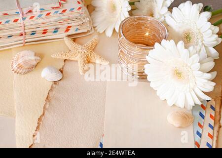 Vintage letters, paper cards and flowers on the table. Romantic correspondence concept, blank space. Stock Photo