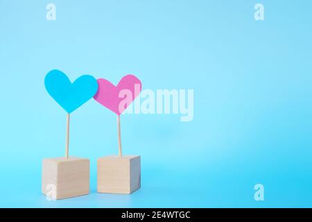 Pink and blue heart shape icon cutout together with copy space. Valentine's Day celebration, marriage, couple and love concept. Stock Photo