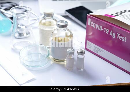 Testing kit result by using rapid test device for COVID-19, 2019-nCoV Concept. Lab card kit test and equipment for viral novel coronavirus. Top view Stock Photo