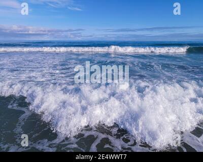 Ocean Waves Blue Water and Sky on Sunny Summers Day Stock Photo