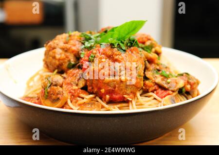 whole wheat spaghetti and meatballs in tomato sauce Stock Photo