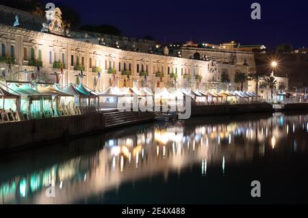 night view of Valletta waterfront and Grand Harbour from the west entrance - Malta Stock Photo
