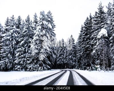 snow covered road in a winter landscape Stock Photo
