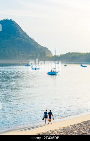 Looking east towards the sunrise and the town of Shoal Bay and Tomaree Head at the entrance to Port Stephens, New South Wales, Australia Stock Photo