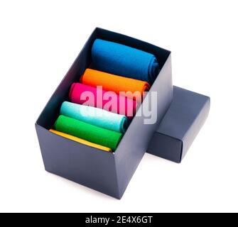 colored socks stacked on a white background Stock Photo