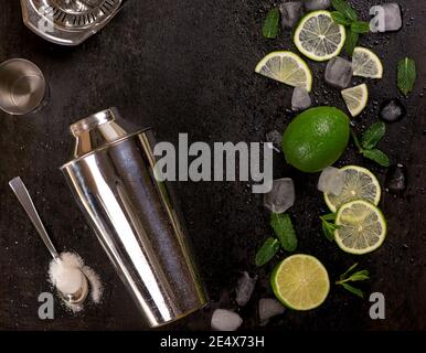 Bar accessories and ingredients for cocktail drink lime, mint, ice. Stock Photo