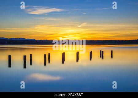 Old landing stage in the sunset on Lake Starnberg, Fuenfseenland, Upper Bavaria, Bavaria, Germany, Europe Stock Photo