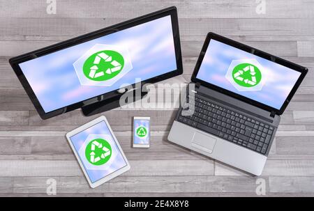 Recycling concept shown on different information technology devices Stock Photo