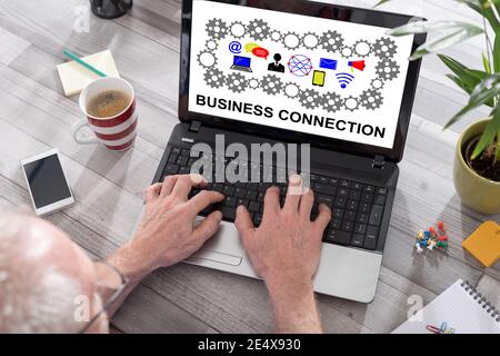 Business connection concept shown on a laptop used by a man Stock Photo