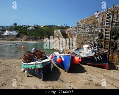 Low tide in the harbour at Gorran Haven, Cornwall. Note the traditional wiithy crab pots. Stock Photo