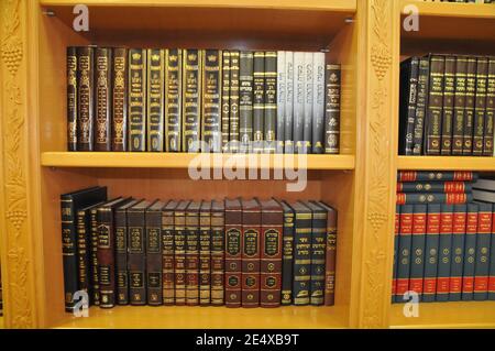 Jewish bookcase Jewish Prayer books (Sidur) and religious works on a shelf in a bookcase Stock Photo