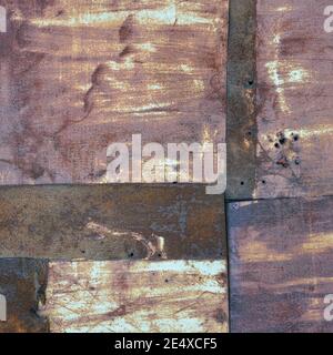 Old aged weathered rusty corroded coat iron sheets texture pattern, multiple horizontal rusted corroding grunge metal patch plates, rustic patched Stock Photo