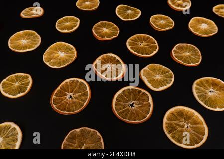 Flat lay of dried sliced oranges, repetitive seamless pattern. Stock Photo