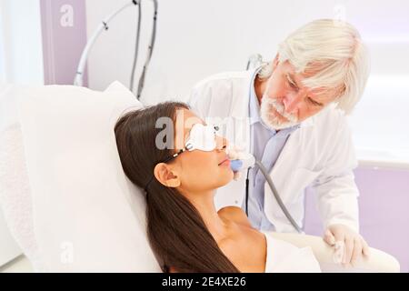 Woman having skin resurfacing by laser treatment at the dermatologist Stock Photo