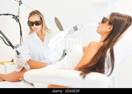 Beautician or dermatologist for hair removal with the alexandrite laser Stock Photo