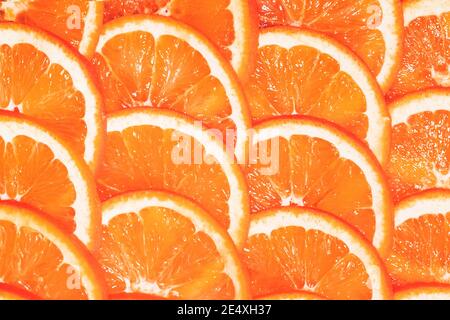 Fresh grapefruits on wooden table. grapefruit cut into slices Stock Photo