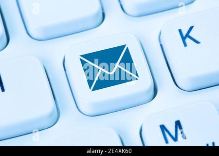 Email E-Mail sending send mail letter internet blue symbol computer keyboard Stock Photo