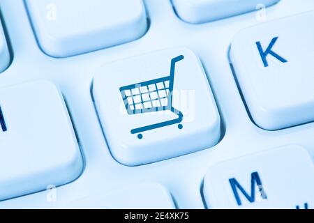 e-commerce ecommerce online shopping internet shop ecom concept symbol blue computer keyboard Stock Photo