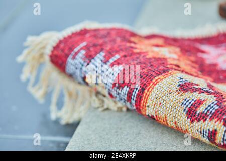 Small carved rug on white background Stock Photo