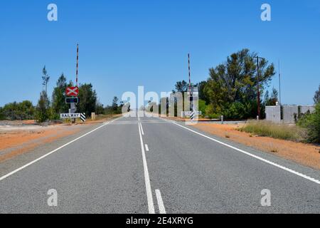 Australia, railway crossing and spread line on Brand  highway in Western Australia Stock Photo