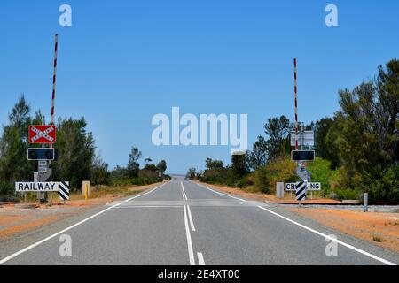 Australia, railway crossing and spread line on Brand  highway in Western Australia Stock Photo