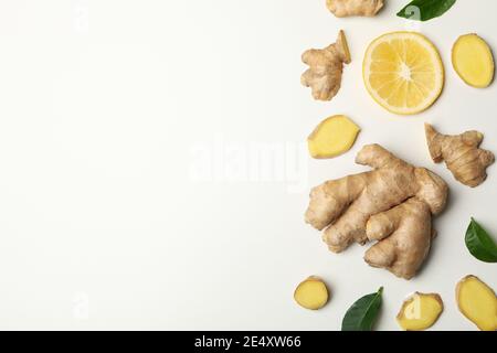 Fresh ginger and lemon on white in top view, an immunity boosting ginger and lemon flat lay Stock Photo