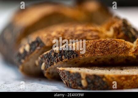 Sliced seeded sourdough bread with a shallow depth of field Stock Photo